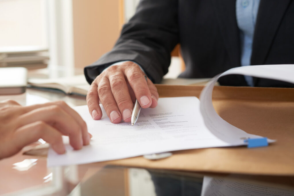 business-people-signing-contract Business people signing contract